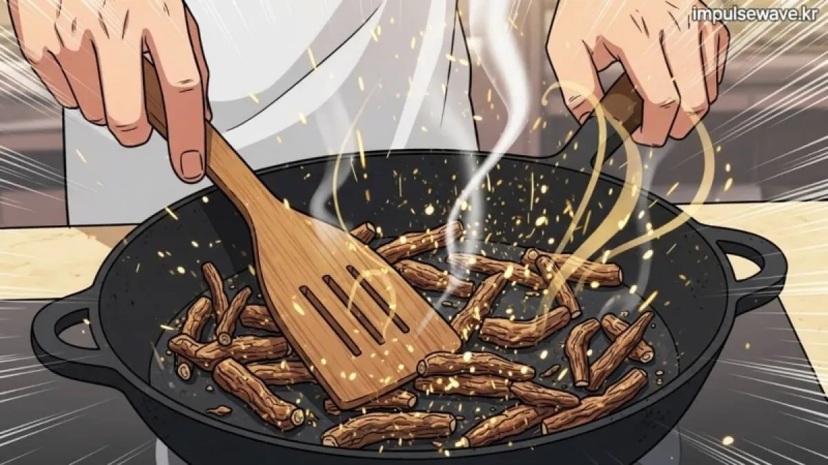 무쇠 팬에서 맥문동을 주걱으로 볶고 있는 조리 장면과 구수한 연기 묘사